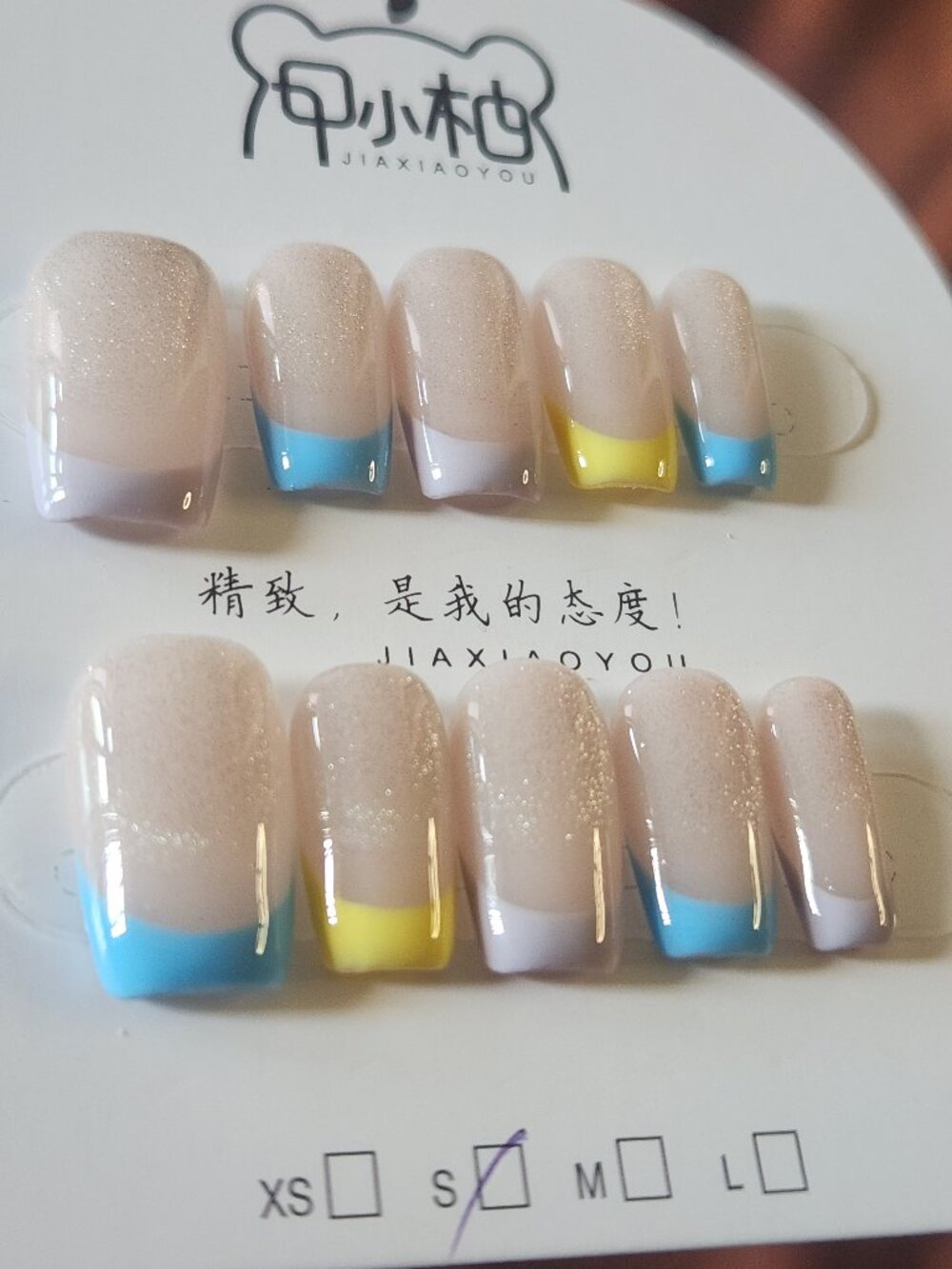 Short 2.0 multi-color pastel French tip press-on nails. Size Small.